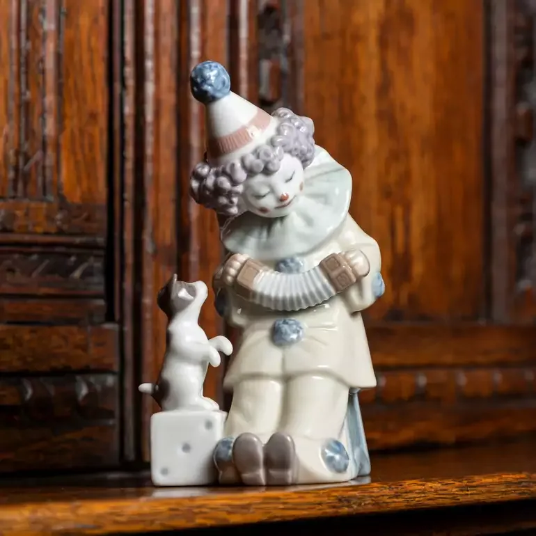 Порцелянова статуетка Lladro «Клоун П'єро з цуценям і гармонню»